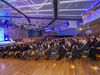 Rows of chairs filled with conference delegates at an event in the Congress Center of Messe Frankfurt.