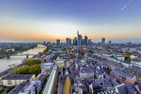 View of Frankfurt's New Old Town, the River Main and the skyline from St. Bartholomew Cathedral in sunshine and blue sky.