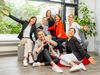 Group picture of the Frankfurt Convention Bureau, all stretching out their arms in joy, one person forming a heart with her hands. 